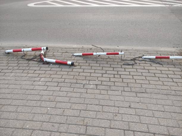 istock Fallen fence posts on the road, traffic accident 2162640732