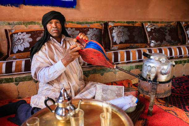 istock Moroccan man preparing Maghrebi mint tea. 2162641428