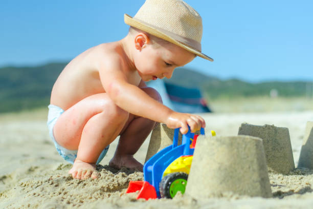 istock Boy playing in the sand stock photo 2162641949