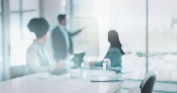 istock Blur, teamwork and business people in meeting, presentation and conversation for feedback. Group, employees and coworkers with discussion for agenda, review company or coaching with mentor or project 2162643033