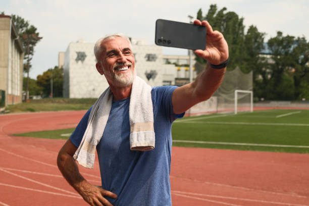 istock Experienced Runner at Sports Stadium Making Selfie 2162644146