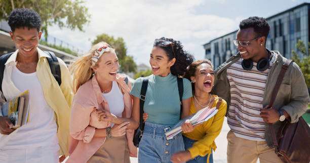istock Walking, laughing and students at university with fun for learning, bonding and talking. People, diversity and group of gen z friends outdoor with books ready for education at college campus. 2162644436