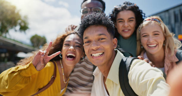 istock Selfie, students and group with diversity, smile and education with break, cheerful and bonding together. Face, people and friends with picture for memory, peace sign and playful with fun and joyful 2162644444