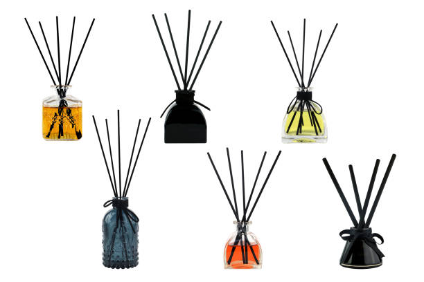 luxury aroma scent reed diffuser glass bottles are on white table to creat romantic and relax ambient in bedroom with grey cracked cement wall background in the morning of happy valentine day