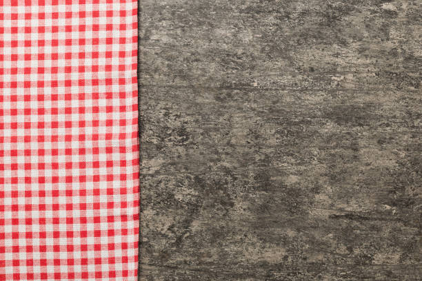 istock top view with red empty kitchen napkin isolated on table background. Folded cloth for mockup with copy space, Flat lay. Minimal style 2162649078