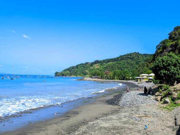 istock beautiful rocky beach with blue water 2162650358