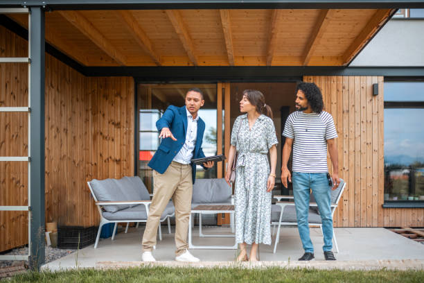 istock Diverse Couple Exploring Property with Hispanic Real Estate Agent 2162651047