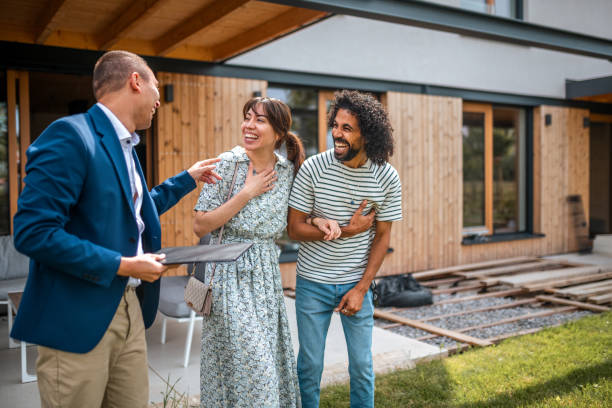 istock Diverse Couple in Homebuying Process with Hispanic Agent 2162651052