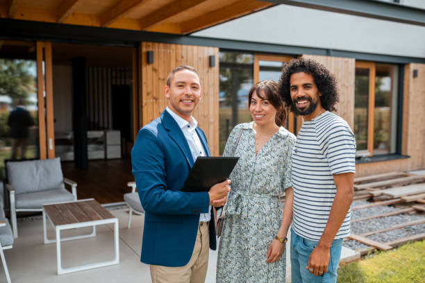 istock Diverse Couple with Agent at New Home 2162651053