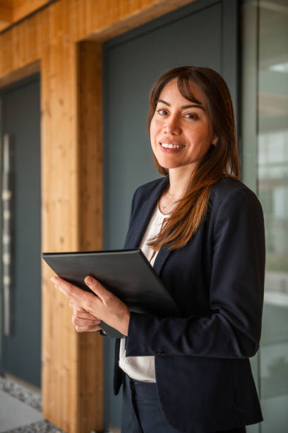istock Confident Hispanic Female Agent at Property Venue 2162651133