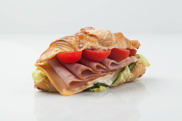 istock A sandwich is a food made by putting meat, eggs, cheese, vegetables, etc. between two thinly sliced ​​pieces of bread spread with butter or mayonnaise sauce. 2162651445