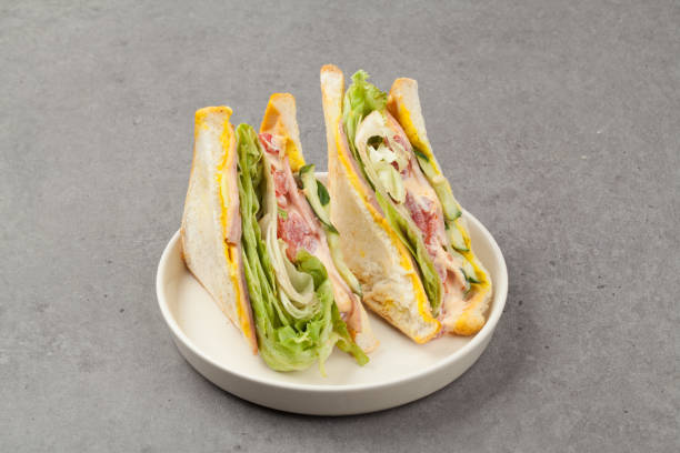 istock A sandwich is a food made by putting meat, eggs, cheese, vegetables, etc. between two thinly sliced ​​pieces of bread spread with butter or mayonnaise sauce. 2162651678