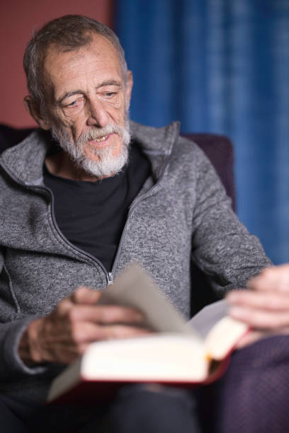 istock Mature man relaxing at home with a good book 2162653763