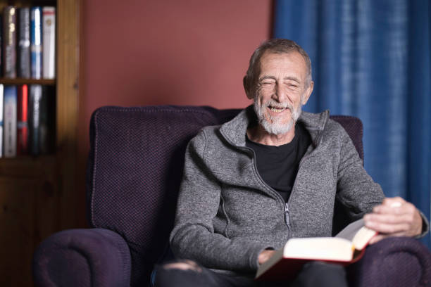 istock Mature man relaxing at home with a good book 2162653828