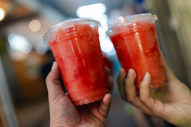 istock Two  plastic cup of watermelon smoothie 2162653869