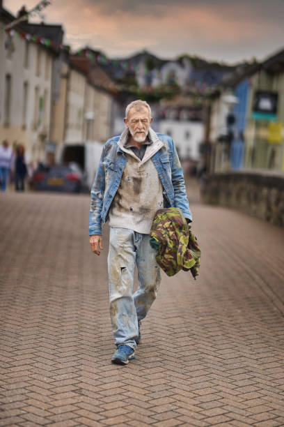 istock Homeless man wandering the streets 2162655147