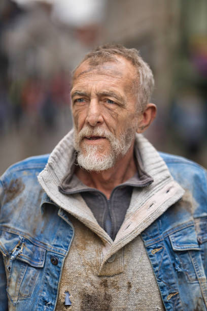 istock Homeless man wandering the streets 2162655177