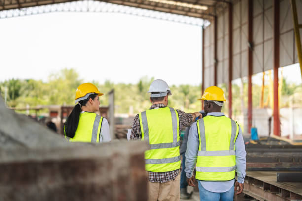 istock Group of Engineer and foreman worker team inspect the construction site, Site manager worker and builder on construction site 2162655608