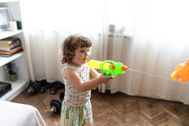 istock Having a water fight with dad 2162659065