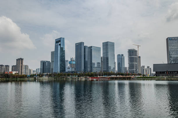 istock Modern Skyscrapers Reflecting in Calm Water 2162660198