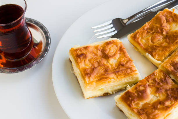 istock Sliced cheese patty with cup of tea 2162660625