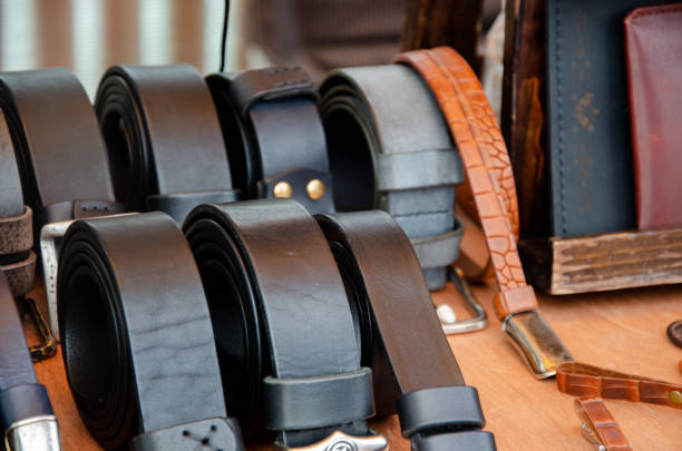 Designer handmade leather goods lie on the shelves