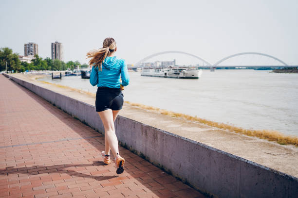 istock Young woman running 2162662357