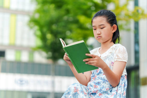 istock Little Girl Reading Book 2162662947