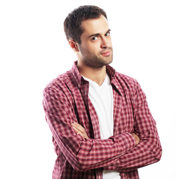 istock Handsome young man in shirt looking at camera 2162664874