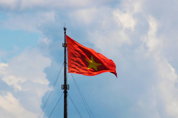 istock Vietnamese Flag Waving Against Semi Cloudy Sky 2162664896