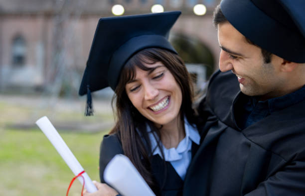 istock Happy students celebrating together on their graduation day 2162665180