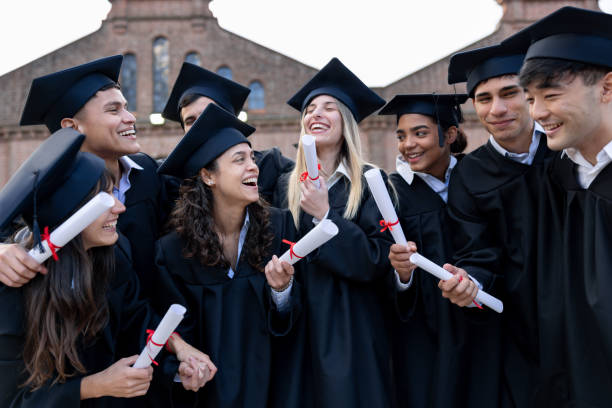 istock Happy group of students celebrating on their graduation day 2162665185