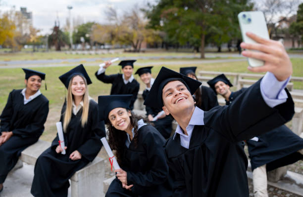 istock Happy graduate students taking a selfie on their graduation day 2162665214