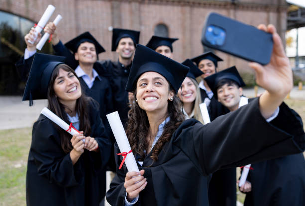 istock Group of students taking a selfie on their graduation day 2162665223