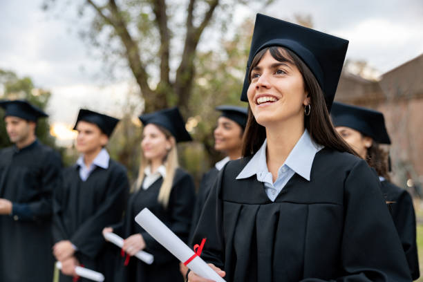 istock Proud graduate student holding her diploma and smiling 2162665255