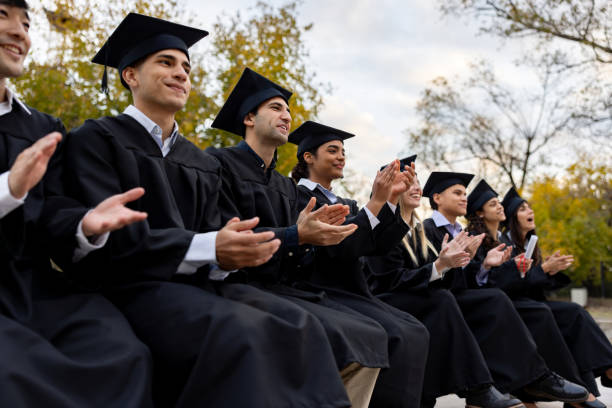 istock Graduate students applauding in their graduation ceremony 2162665294
