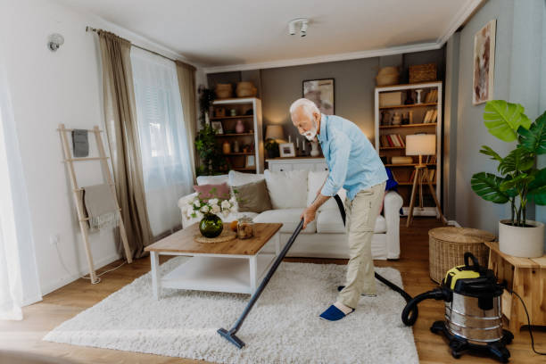 istock Vacuuming in the living room 2162669231