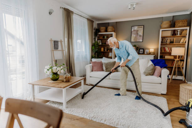 istock Vacuuming in the living room 2162669278