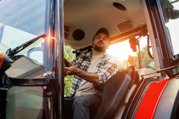 istock Caucasian ethnicity man driving farm or construction tractor. 2162670176