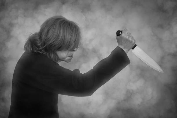 istock Frightening woman holding a knife 2162670218