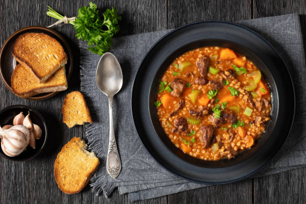 istock beef barley soup in a bowl, top view 2162670518