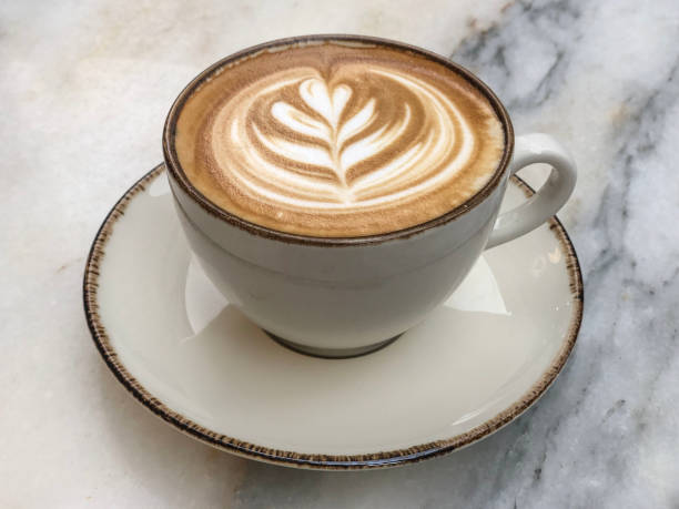 istock cappuccino coffee with latte art on marble table 2162672057