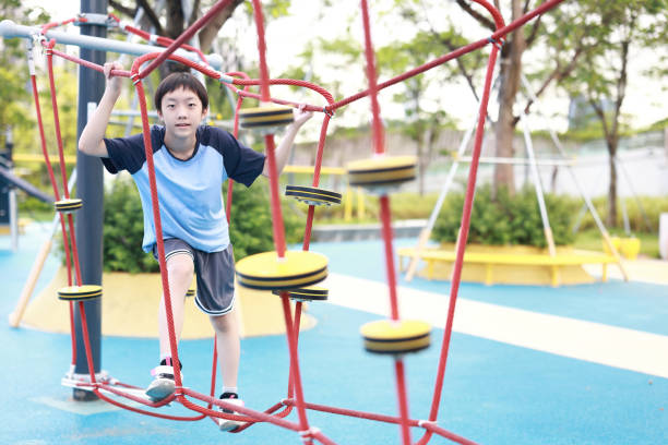 istock Little boy walking on a balance beam 2162673680