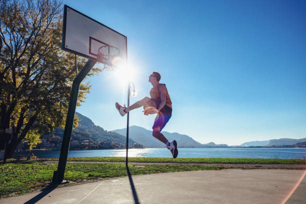 Basketball player training in outdoor basketball court