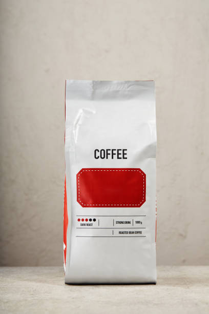 Coffee package against the wall. Blank coffee bag
