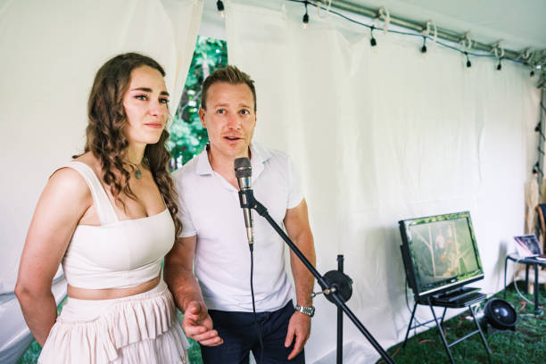 istock Bride and groom speaking at the wedding party dinner 2162677801