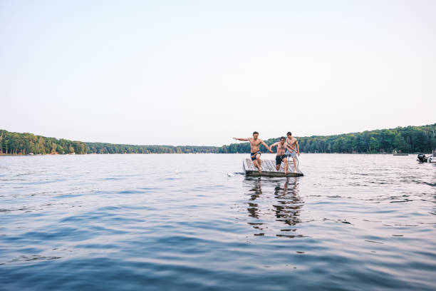 istock Two young men having fun at the lake 2162678103