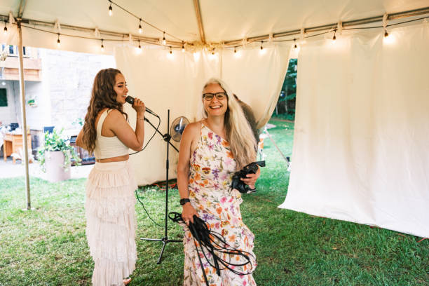 istock Bride singing karaoke at the wedding party 2162678301