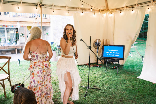 Bride singing karaoke at the wedding party