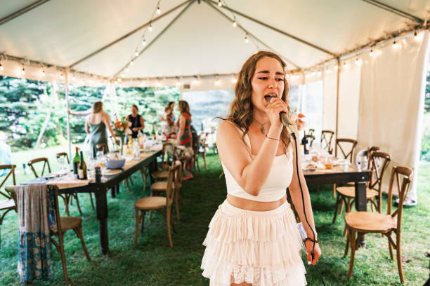 Bride singing karaoke at the wedding party